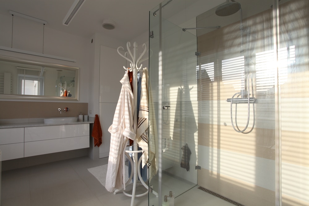 Bright glass shower layout paired with accessible vanity planning