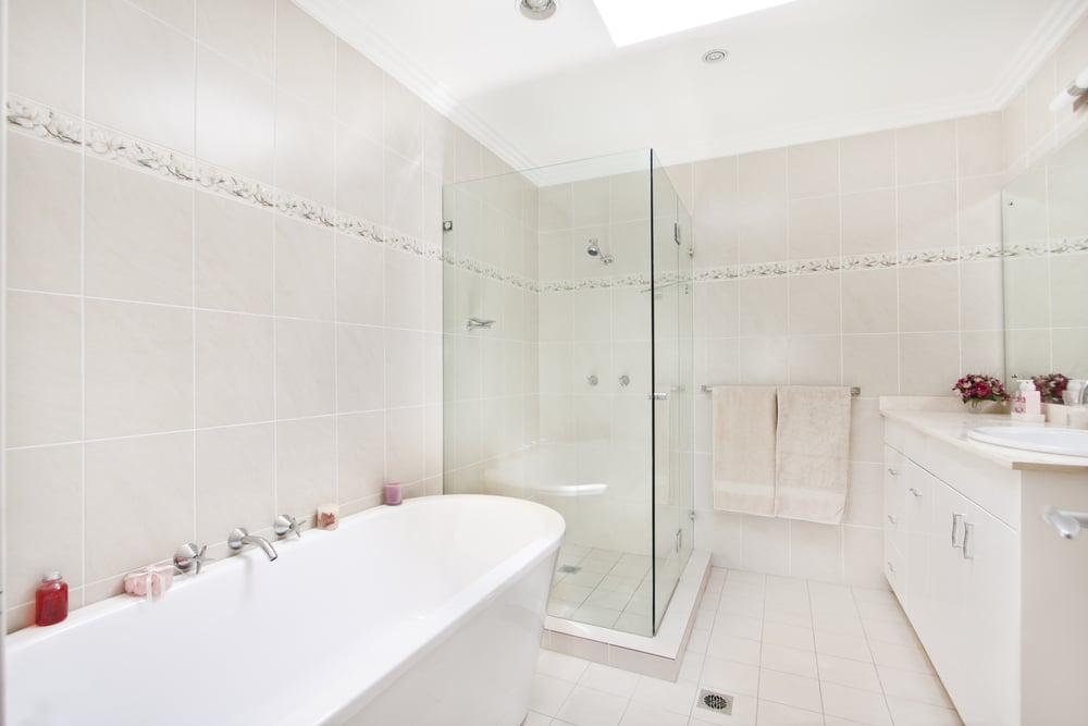 Updated bathroom with glass shower and open layout