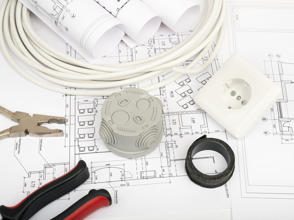 Blueprints and planning materials for a bathroom remodel budget